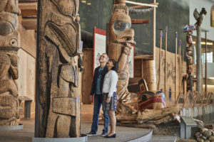 Travellers look at totem poles at the Canadian Museum of History – credit: Canadian Museum of History