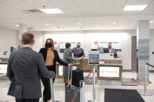 Travellers checking in at the Air Canada counters in the Fredericton International Airport