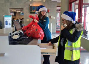 WestJetters prepare to hand out gifts to passengers at the Fredericton International Airport