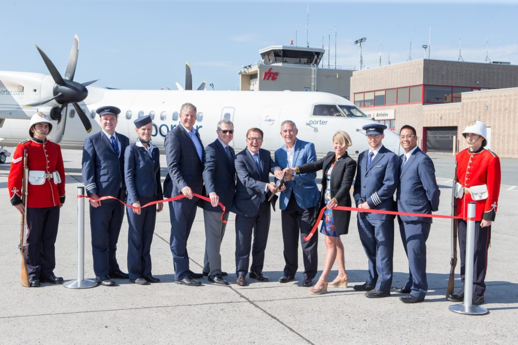 Ribbon cutting ceremony at the inaugural Porter flight to YFC
