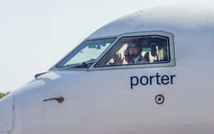 Porter Pilot waves hello at the Fredericton International Airport